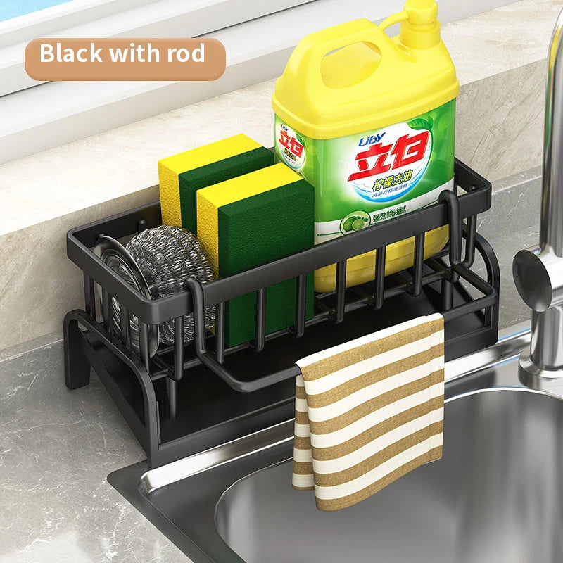 Black kitchen sink organizer rack with rod holding sponges, scrubber, and detergent by Glow Market Home