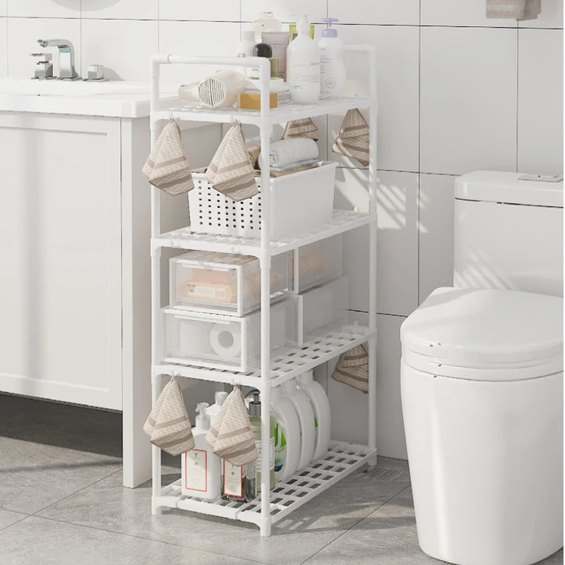 White multi functional metal storage shelves in bathroom holding toiletries and towels